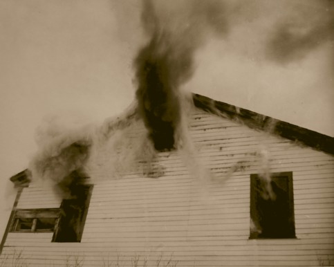 Smoke coming out of the three windows on the west side of the Inn