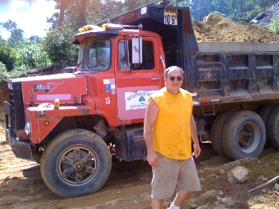 James-LaMountain-moving-dirt-up-on-the-hillside-farm-here-in-Holland
