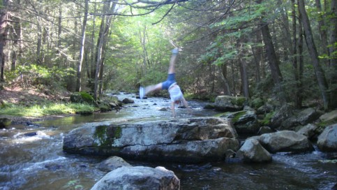 Faster moving Quinebaug river with big boulders.