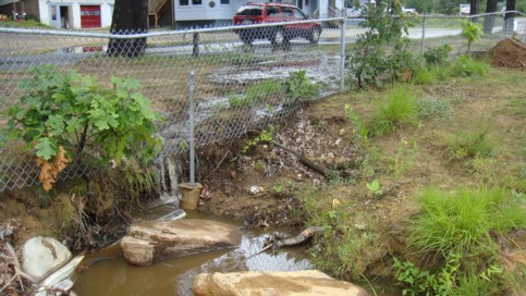 Water crossing Mashapaug Road and eroding the beach at PJ’s.