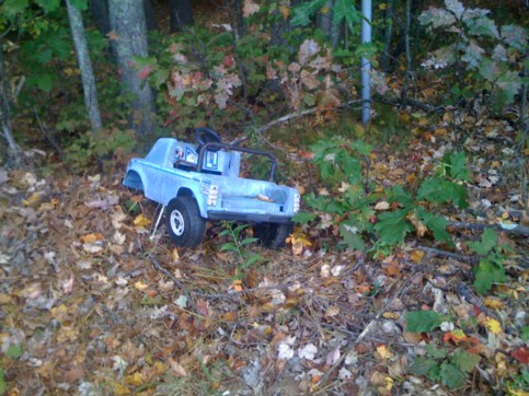 toy pedal car dumped on the side of East Brimfield Road