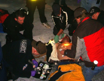 "EMT-stabilizing-Howard-Crow-after-the-accident"width=415