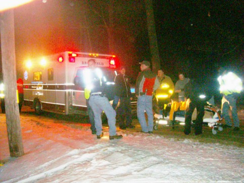 Howard Crow is loaded into the waiting Ambulace.