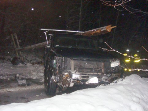 Telephone pole on top of the pickup truck