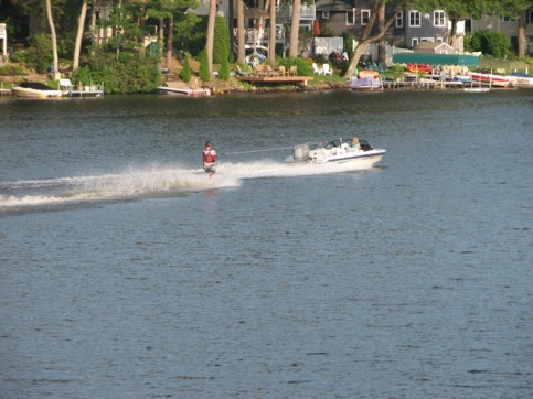 Lynn Arnold driving the boat and acting as spotter at the same time...