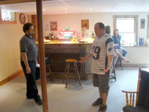 Herb and Douglas Farmer in front of bar in the basement