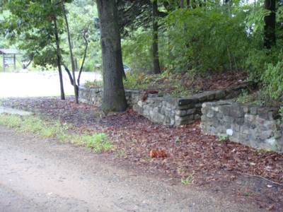 Stone wall and steps leading up to a former residence