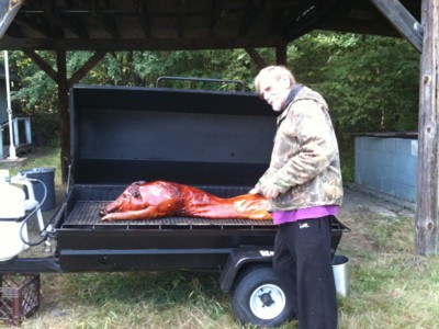 Al checking on the roasted pork.