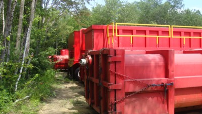 Adler hazardous waste tanks parked off Mashaupaug Road