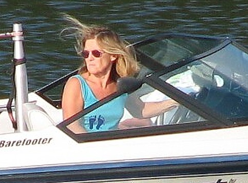 Lynn Arnold driving the boat and acting as spotter at the same time, she is above the law...